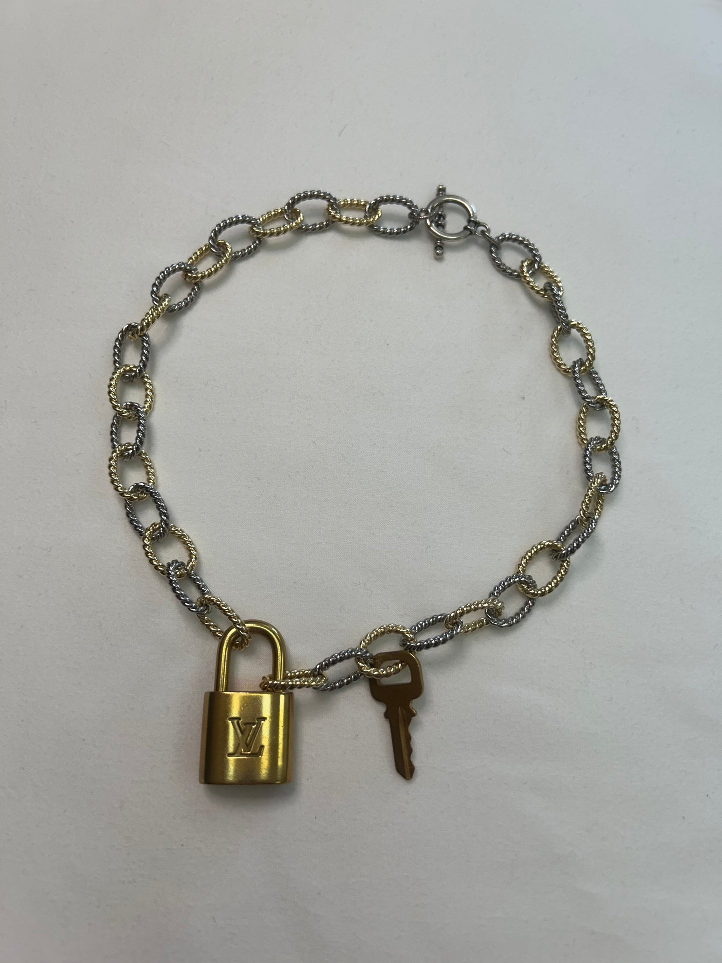 008- Authentic LV Lock Multi-Tone Single Strand Necklace