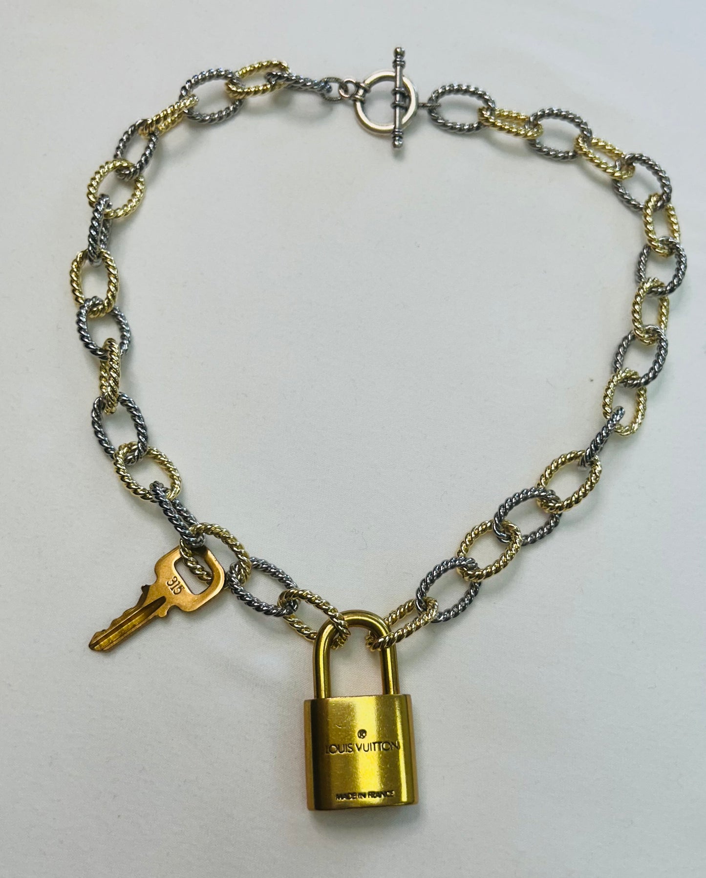 008- Authentic LV Lock Multi-Tone Single Strand Necklace